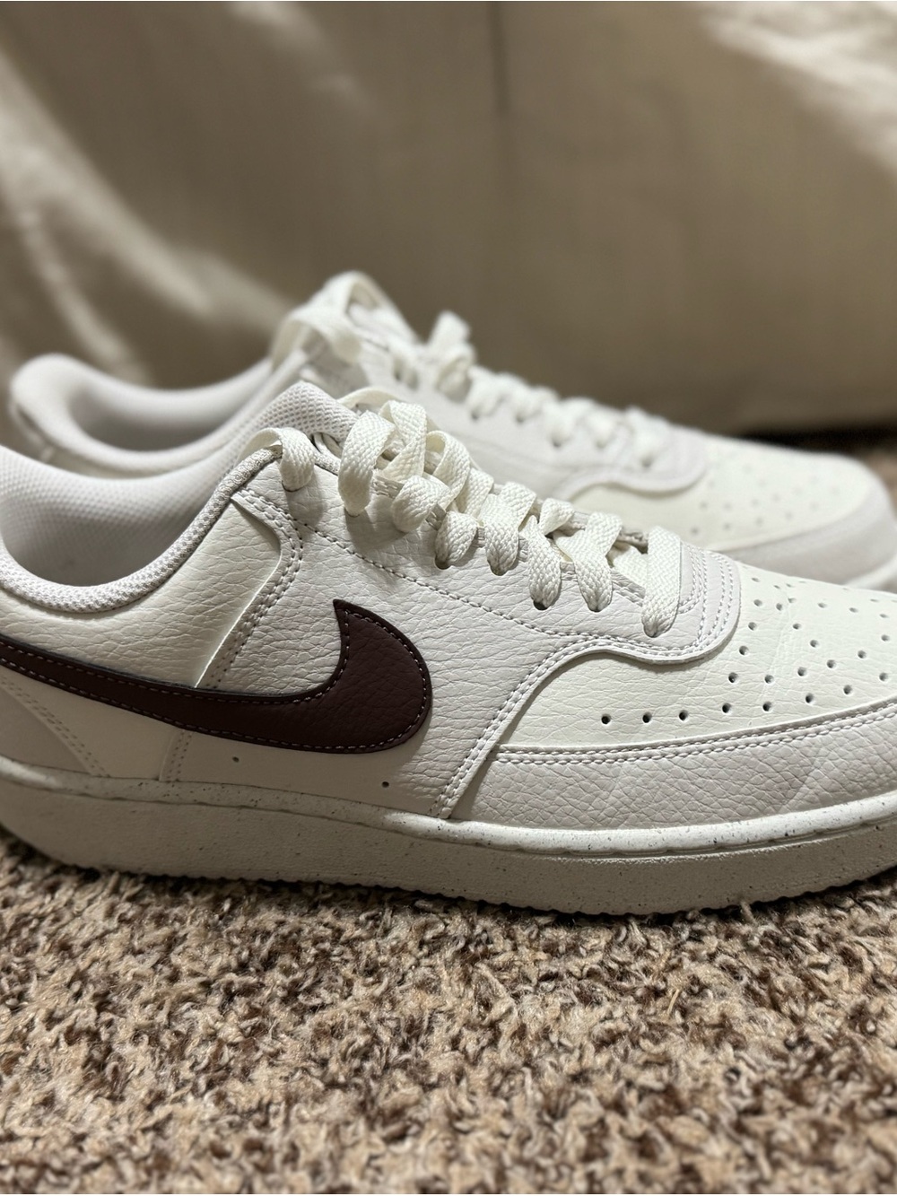 Nike women’s White Leather Sneakers with Brown Swoosh